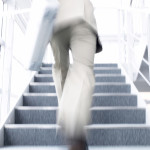 Businessman Running Up Stairs